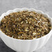 A white bowl of Davidson's Organic Energize loose leaf tea.
