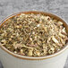 A bowl of Davidson's Organic Digest Herbal Loose Leaf Tea.