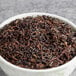 A bowl of Davidson's Organic Mountain Copper Oolong tea.