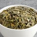 A bowl of Davidson's Organic Dragonwell green tea leaves.