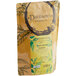 A brown bag of Davidson's Organic Peach Apricot Essence Loose Leaf Tea with a green and yellow label.