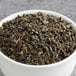 A bowl of Davidson's Organic Gunpowder Green Loose Leaf Tea.