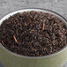 A bowl of Davidson's Organic Dunsandle Nilgiri loose leaf black tea.