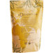 A yellow bag of Davidson's Organic Tulsi Pure Leaves Herbal Loose Tea with text and leaves.