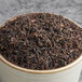 A bowl of Davidson's Organic Sun, Moon, and Stars black loose leaf tea.
