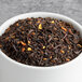 A bowl of Davidson's Organic Orange Spice loose leaf tea.