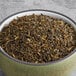 A bowl of Davidson's Organic Imperial Green loose leaf tea.