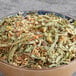 A bowl of Davidson's Organic Lemon Medley herbal loose leaf tea.