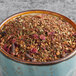 A bowl of Davidson's Organic Christmas Herbal Loose Leaf Tea.