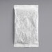 A white paper bag of Davidson's Organic Raspberry Iced Tea Filter Packs on a gray surface.