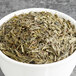 A bowl of Davidson's Organic Sencha green tea leaves.