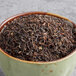 A bowl of Davidson's Organic Singell Darjeeling loose leaf tea.