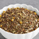 A bowl of Davidson's Organic Tulsi Chamomile Flower tea leaves.