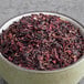 A bowl of Davidson's Organic Hibiscus Flowers Cut & Sift tea.