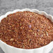 A bowl of brown powder labeled "Davidson's Organic Red Vanilla Herbal Loose Leaf Tea"