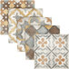 A white display of tan tiles with different patterns on them.