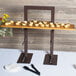 A Madera rustic pine shelf for a 3 tier frame riser with pastries on it.
