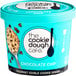 A blue container of The Cookie Dough Cafe chocolate chip cookie dough with a white label.