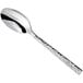 A Oneida stainless steel teaspoon with a textured handle.