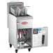 An Avantco stainless steel natural gas floor fryer with the door open and two baskets on wheels.