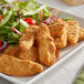Gardein Plant-Based Chick'n Tenders on a plate with salad.