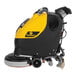 A yellow and black Tornado cordless walk behind floor scrubber with wheels and a handle.