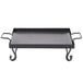 An American Metalcraft wrought iron griddle in a black frame with two handles.
