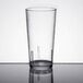 A close-up of a clear Cambro plastic tumbler on a table.