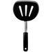 An OXO Good Grips black silicone pancake spatula with a black handle.