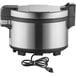 A stainless steel Proctor Silex electric rice warmer with a cord attached.