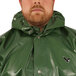 A man wearing a Tingley green Iron Eagle hood over a raincoat.