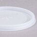 A white plastic lid with a straw slot.