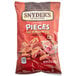 A bag of Snyder's Hot Buffalo Wing Pretzel Pieces on a table.