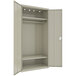 A putty metal Hirsh Industries wardrobe cabinet with shelves.