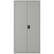 A light gray steel storage cabinet with black handles and doors by Hirsh Industries.