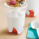 A Yoplait Dairy-Free Vanilla Coconut Milk Parfait Yogurt Alternative cup with granola and fruit.