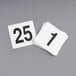 A stack of white Choice 4" plastic table number cards with black numbers.