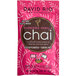 A pink package of David Rio Vanilla Decaf Sugar-Free Chai Tea Latte with white text and a black circle with white text.