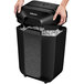 A black Fellowes paper shredder with a hand opening it.