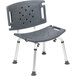 A gray plastic shower chair with a metal frame and extra large backrest with holes.