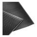 A close-up of a black Lavex Diamond Deluxe anti-fatigue mat with a diamond pattern.