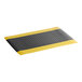 A black anti-fatigue mat with yellow borders.
