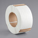 A roll of white plastic strapping tape with an 8" x 8" core.