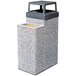 A grey rectangular Wausau Tile 4-way top for a square concrete waste and cigarette ash receptacle.