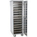 A Cres Cor sheet pan rack with metal trays in a metal cabinet.