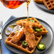 Rebellyous Vegan Plant-Based Chicken Tenders on a waffle with jalapenos.
