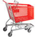 A red Regency shopping cart with a basket on wheels.