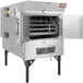 A Southern Pride SPX-300 stainless steel commercial rotisserie smoker with the door open.