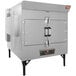 A large metal Southern Pride rotisserie smoker with doors.