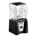 A black and silver Blendtec Connoisseur 825 commercial blender with a clear container on the counter.